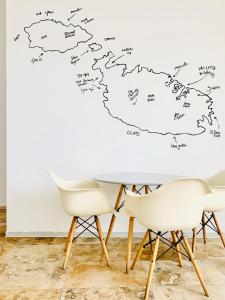 a map of the british isles on a wall at Inhawi Boutique Hostel in St. Julianʼs