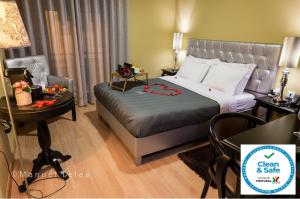 Кровать или кровати в номере Hotel Tulipa