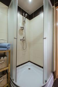 a shower with a glass door in a bathroom at Pas Aldona in Palanga +19 photos