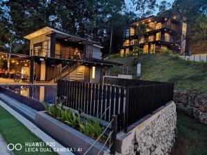 a house on a hill with a pool in front of it at Casa Hill Resort in Sungai Lembing