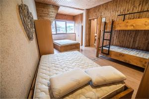 a room with two bunk beds in a cabin at Hostel Paradiso in Tolmin