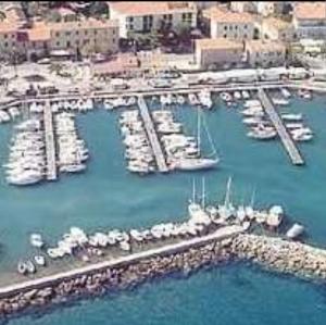 a harbor filled with lots of boats in the water at Cavo Beach 5 in Cavo