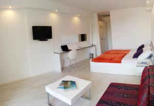 a hotel room with a bed and a table at White House Lopud,Dubrovnik in Lopud