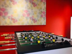 a pool table with dolls on top of it at Aparthotel Adagio access München City Olympiapark in Munich