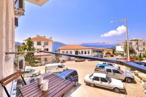 a balcony with cars parked in a parking lot at Zeytin HOTEL in Kaş