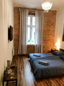 Posteľ alebo postele v izbe v ubytovaní Topolove Rooms & Apartments