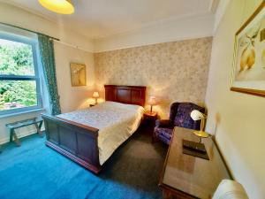 Säng eller sängar i ett rum på Belvedere Lodge
