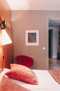 a bedroom with a bed and a lamp at Centro Hotel Turku in Turku