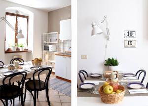 une cuisine et une salle à manger avec une table et des chaises dans l'établissement Casa San Giacomo 1, à Riva del Garda