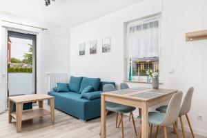 Posedenie v ubytovaní Sunny Rewal Apartments by Noclegi Renters