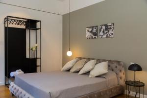 Кровать или кровати в номере Suite della Pigna