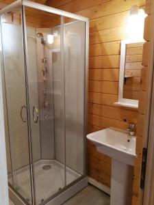 a bathroom with a shower and a sink at Càmping Rural Montori in Ultramort