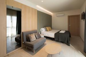 a hotel room with a bed and a chair at Casaenmedio in Valle de Abdalagís