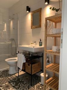 a bathroom with a sink and a toilet at House Damić in Korčula