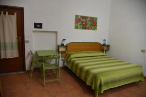 Letto o letti in una camera di B&B ABACO