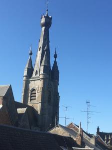 an old church with a tower on top of a building at Coeur de Solrézis in Solre-le-Château