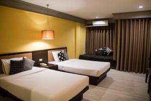 En eller flere senge i et værelse på Aekpailin River Kwai Resort
