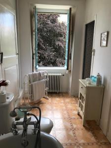 a bathroom with a sink and a window at Chambres d'Hôtes Belle Vallee in Domfront