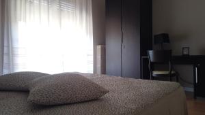 Postel nebo postele na pokoji v ubytování Hotel Cristina