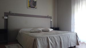 Postel nebo postele na pokoji v ubytování Hotel Cristina