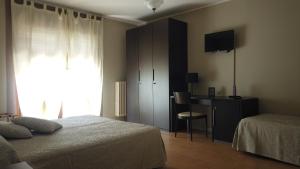 Postel nebo postele na pokoji v ubytování Hotel Cristina