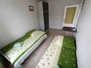 Łóżko lub łóżka w pokoju w obiekcie Apartament-studio, pokoje u Lucy