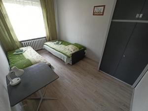 Łóżko lub łóżka w pokoju w obiekcie Apartament-studio, pokoje u Lucy