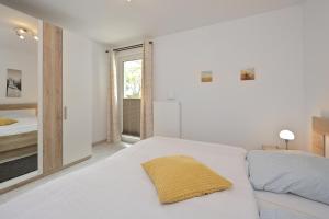 Postel nebo postele na pokoji v ubytování Ferienwohnung Badestrand