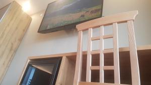 TV a/nebo společenská místnost v ubytování Aparthotel Malga