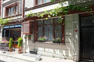 a building with a window with plants on it at Unique Suite Hotel in Istanbul