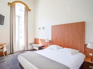 Postel nebo postele na pokoji v ubytování Hotel Du Congres