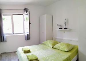 En eller flere senge i et værelse på Apartment Mativa