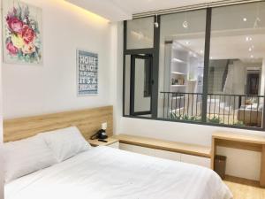 Voodi või voodid majutusasutuse L'amie Hotel & Studio toas