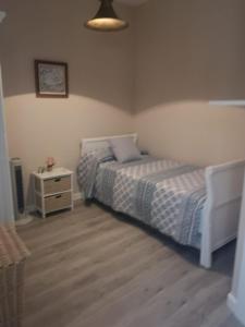 A bed or beds in a room at Ático Aretusa