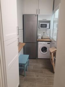 A kitchen or kitchenette at Ático Aretusa
