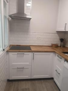 A kitchen or kitchenette at Ático Aretusa