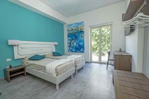 Postel nebo postele na pokoji v ubytování Miti Dello Stretto B&B