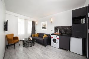 a living room with a couch and a table at Taksim Seya Suites Hotel in Istanbul