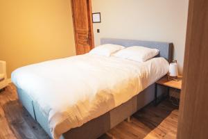 Postel nebo postele na pokoji v ubytování Sint Jacobshoeve