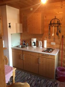 a kitchen with a sink and a counter top at Blockhaus-Traum Huber in Garmisch-Partenkirchen +12 photos