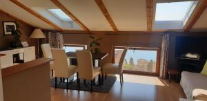 a kitchen and dining room with a table and chairs at Apatmani Milena in Opatija