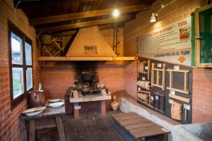 Kuchyň nebo kuchyňský kout v ubytování Hotel Rural El Tejar de Miro