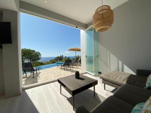 a living room with a couch and a table at Finca Vista in Marbella