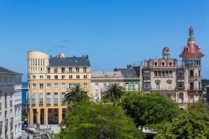a group of buildings and trees in a city at Hotel Ros Mary in Ribadeo