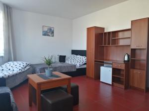 a small living room with a couch and a table at Adria in Sarbinowo