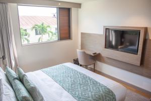 Ένα ή περισσότερα κρεβάτια σε δωμάτιο στο Lava Hotel