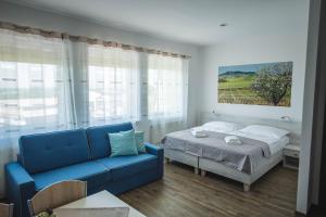 A bed or beds in a room at Apartmány Pemag Mikulov