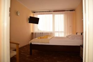 Posteľ alebo postele v izbe v ubytovaní Hotel Gołuń