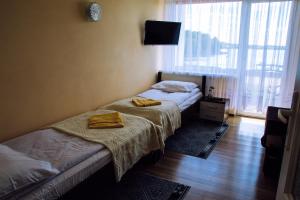Posteľ alebo postele v izbe v ubytovaní Hotel Gołuń
