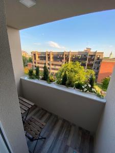 a balcony with a view of a building at Apartman "Noa" in Sremska Mitrovica